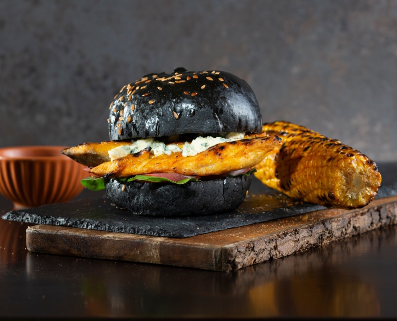  Victoria Grill Gourmet chicken burger on a black charcoal bun in East Kilbride